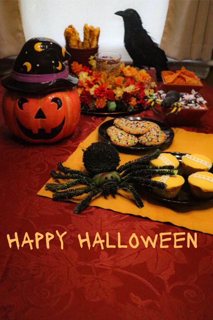 table set for a happy halloween with tricks and treats