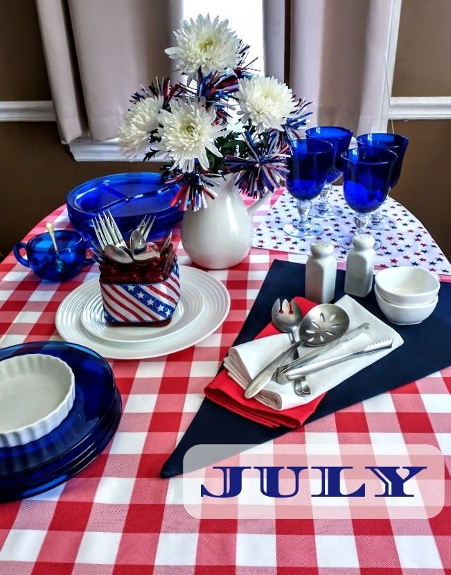 july table scape red and white tablecloth and cobalt blue dishes