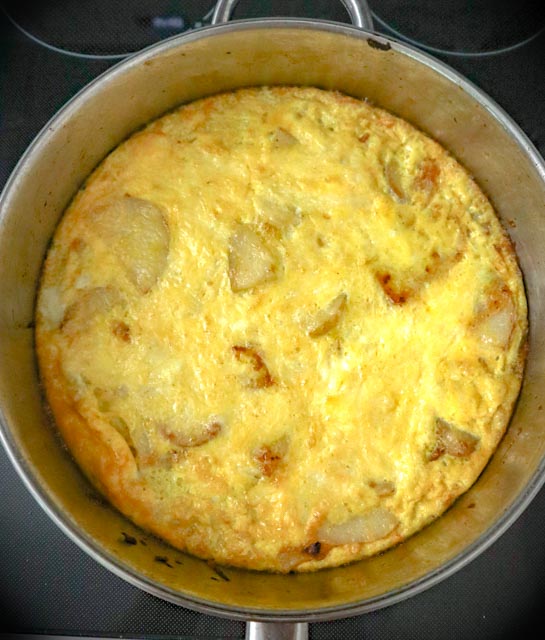 a potato and onion frittata done in the skillet