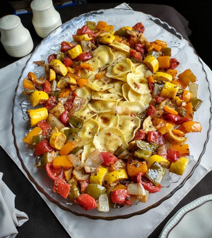 ravioli with roasted vegetables sweet peppers onion plum tomato summer squash roasted in a balsamic olive oil herb dressing