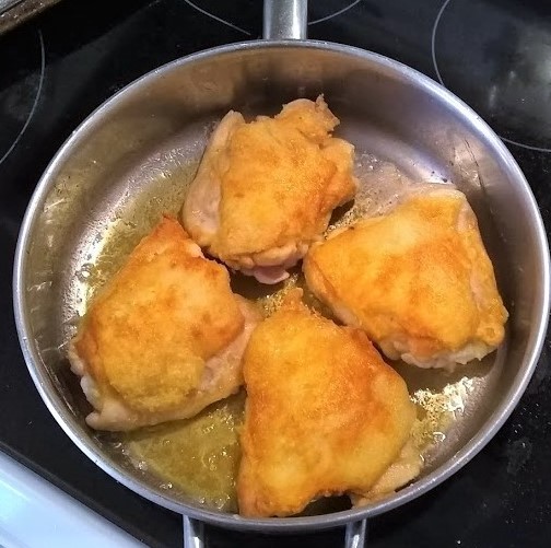 chicken browning in the skillet for cacciatore