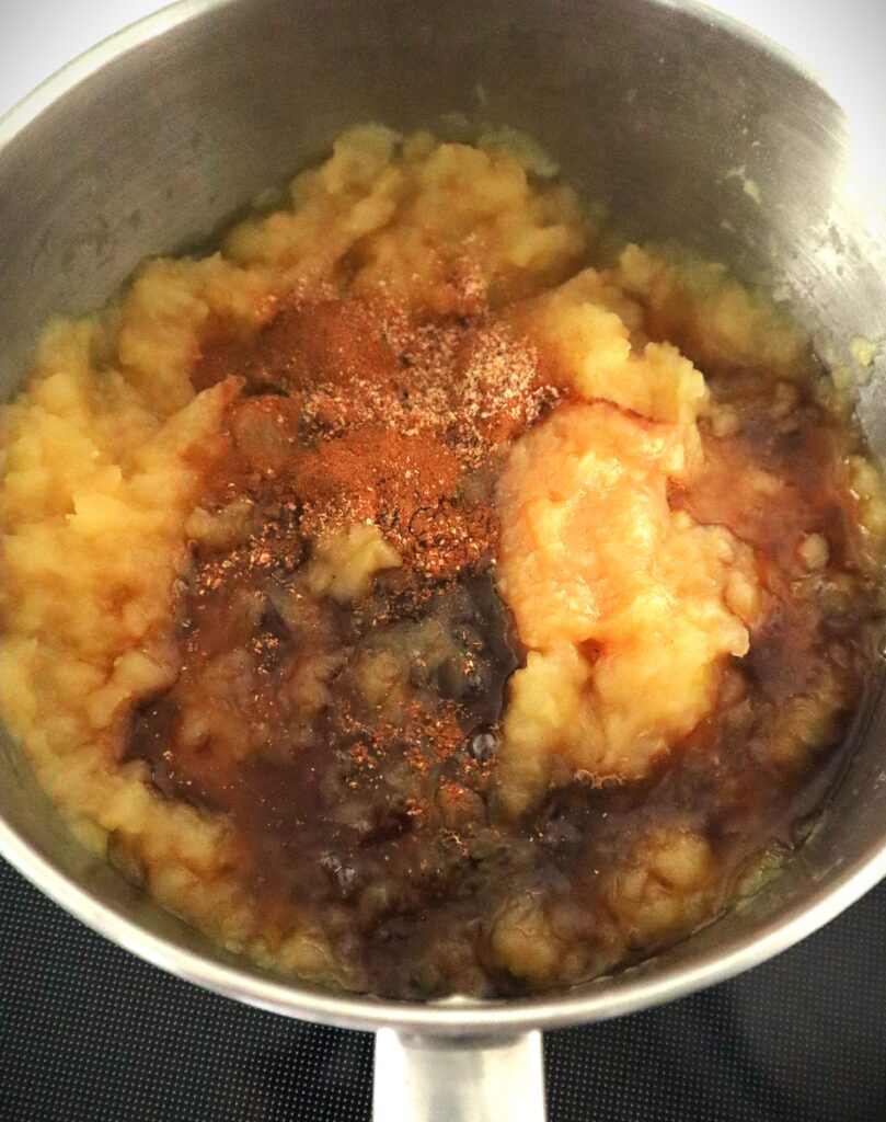 mashed homemade applesauce with spices maple syrup and ginger added