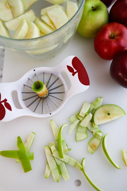 sliced apples whole apples and apple corer