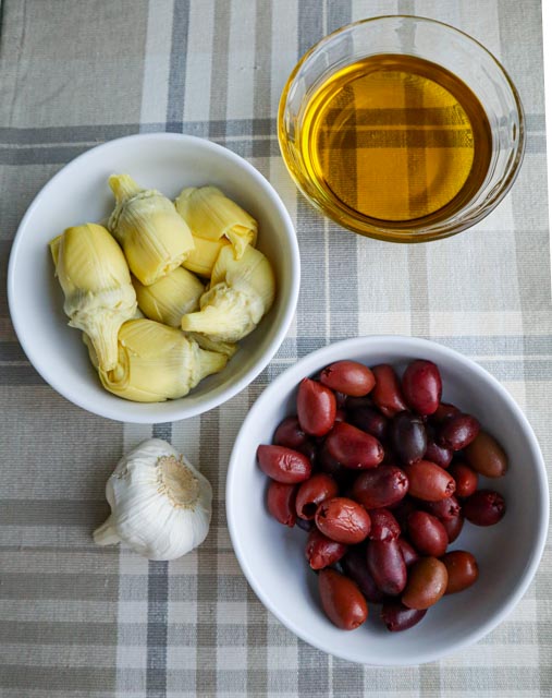 olive and artichoke pasta ingredients artichoke hearts kalamata olives olive oil and a head of garlic