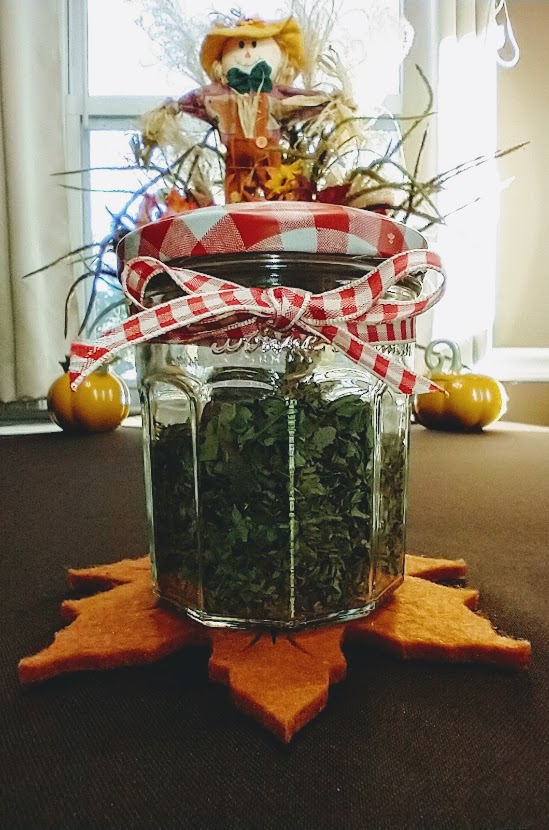 italian herb mix in a jar with a bow