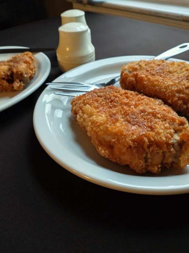 golden fried pork cutlets with a thick crispy crust served