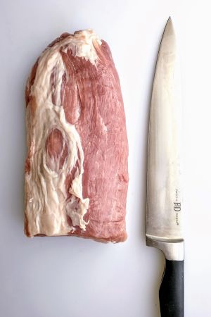 pork loin and straight edged knife