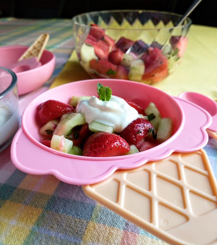 kids salad served in pink ice cream cone dish with ingredients in the background