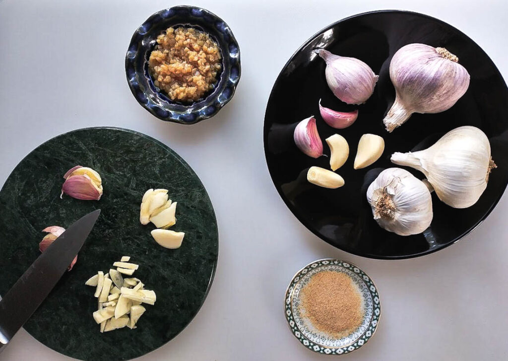 an array of fresh garlic in various colors shapes and types