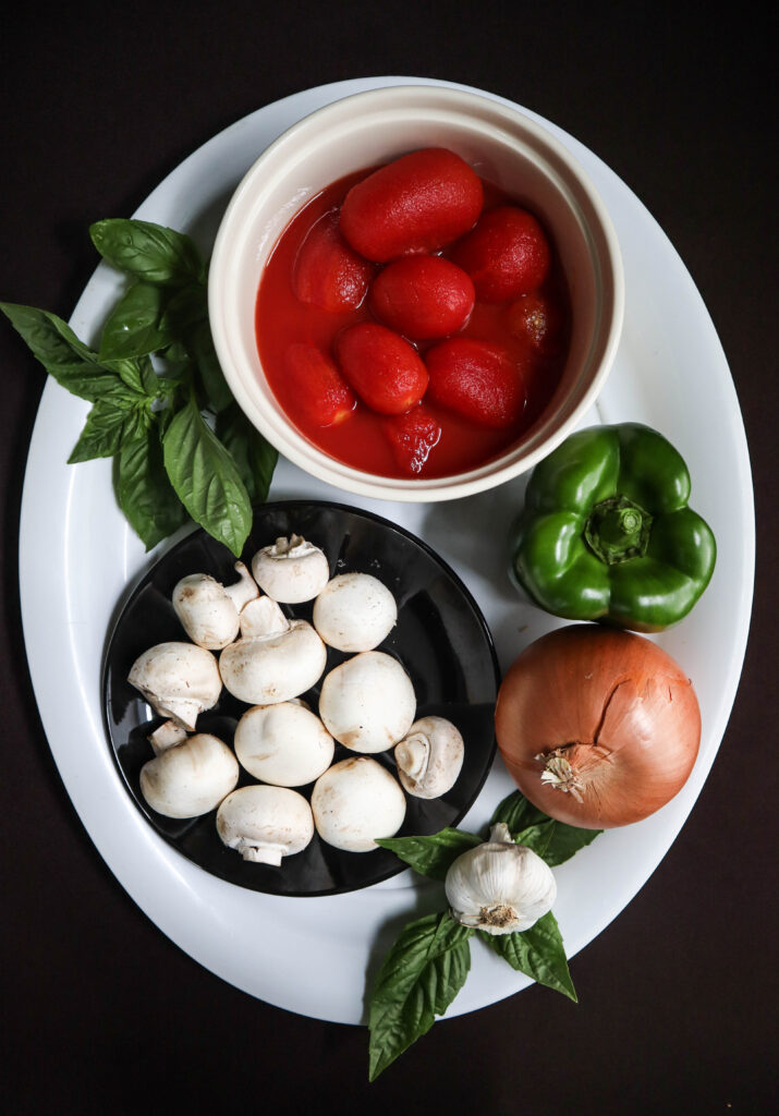 vegetables for chicken cacciatore canned peeled plum tomatoes mushrooms garlic onion green pepper and basil