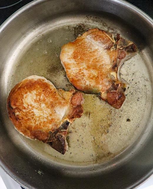 center cut  pork chops searing in skillet