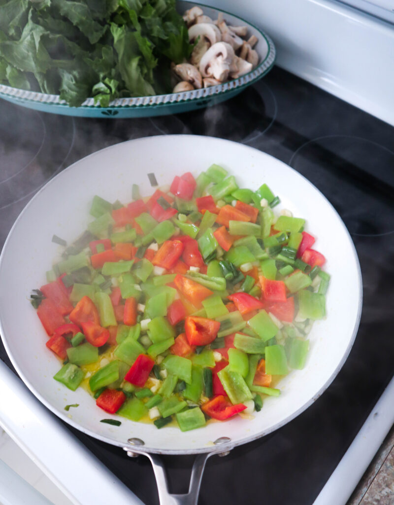 vegetable saute cooking in skillet on stovetop