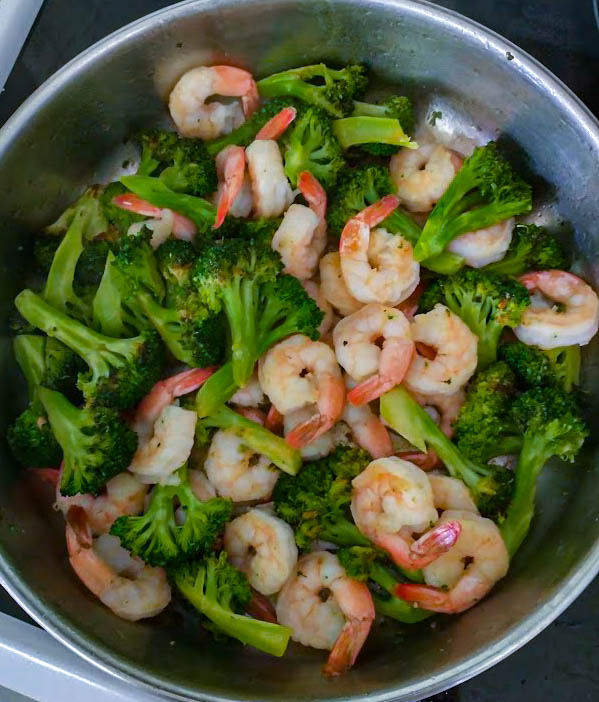 shrimp cooked in skillet with broccoli