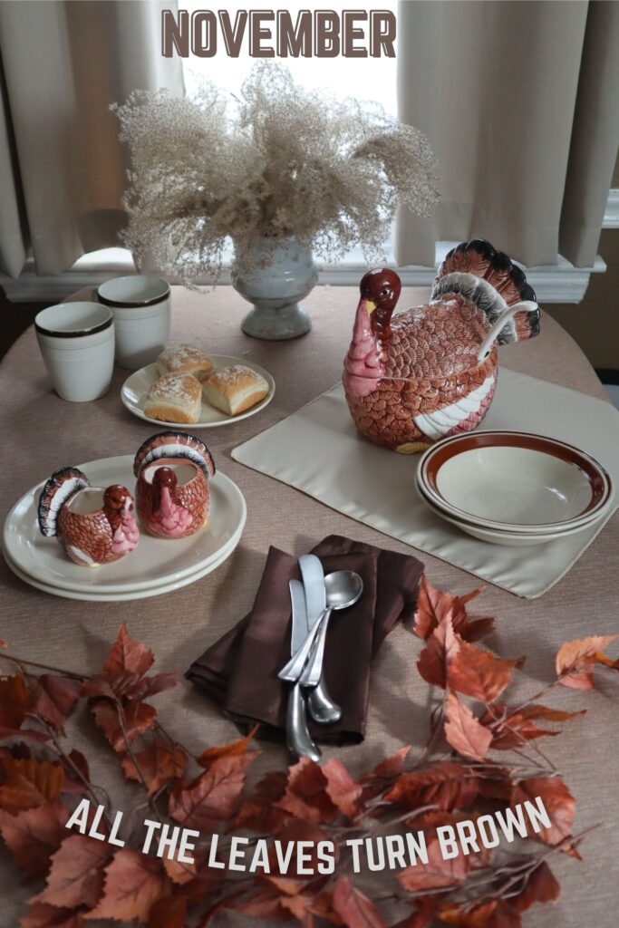 november dinner setting with turkey serving dishes with a theme all the leaves turn brown