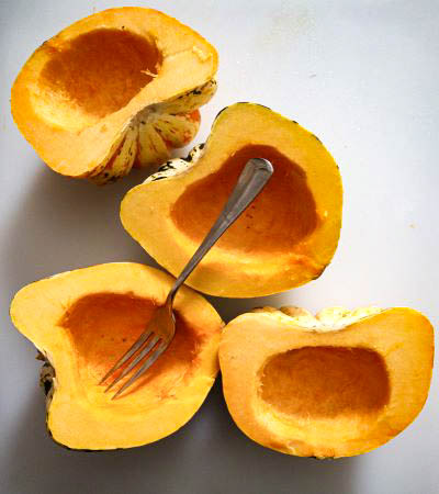 small squash cut in half with seeds removed