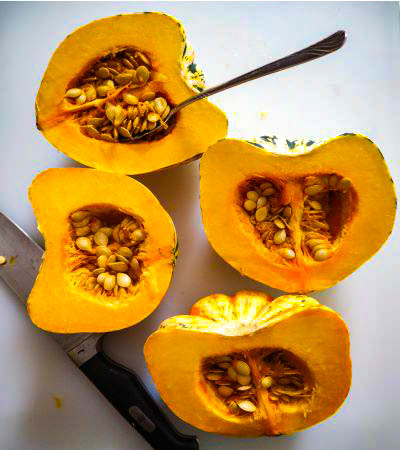 squash cut in half with seeds still in