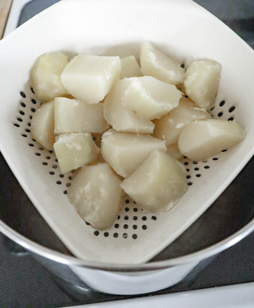 chunks of potatoes in colander