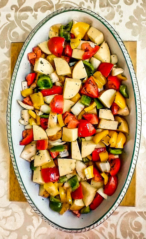 italian roasted vegetables tossed in balsamic dressing ready for oven