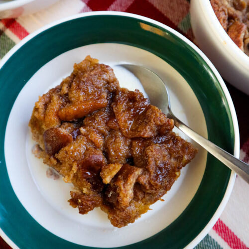 bread pudding with brown sugar topping in single serving bowl with milk