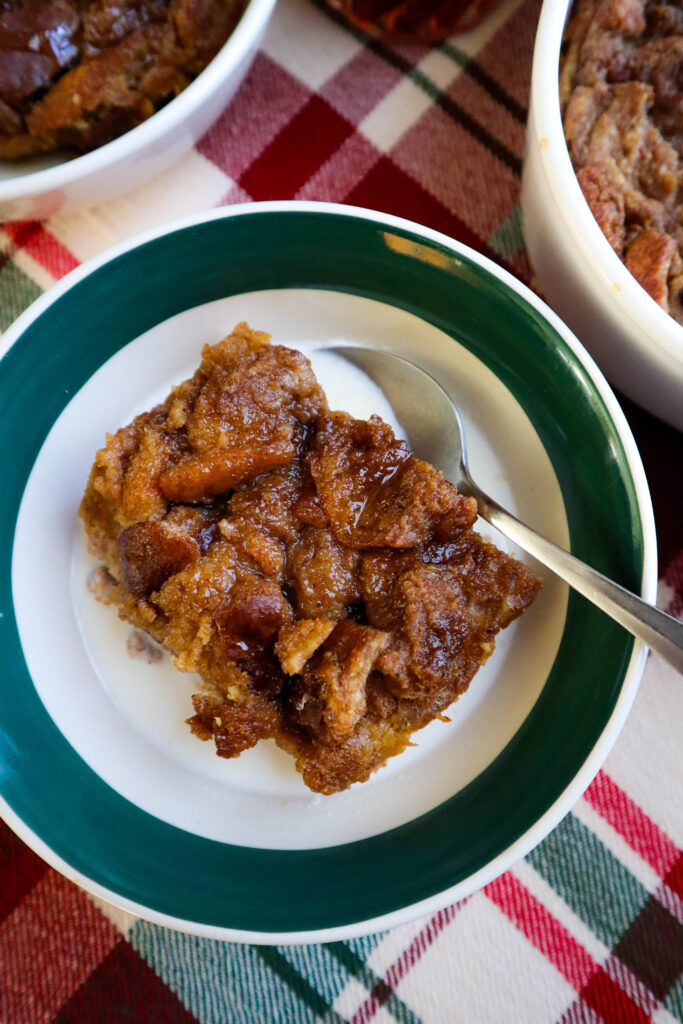 bread pudding with brown sugar topping in single serving bowl with milk