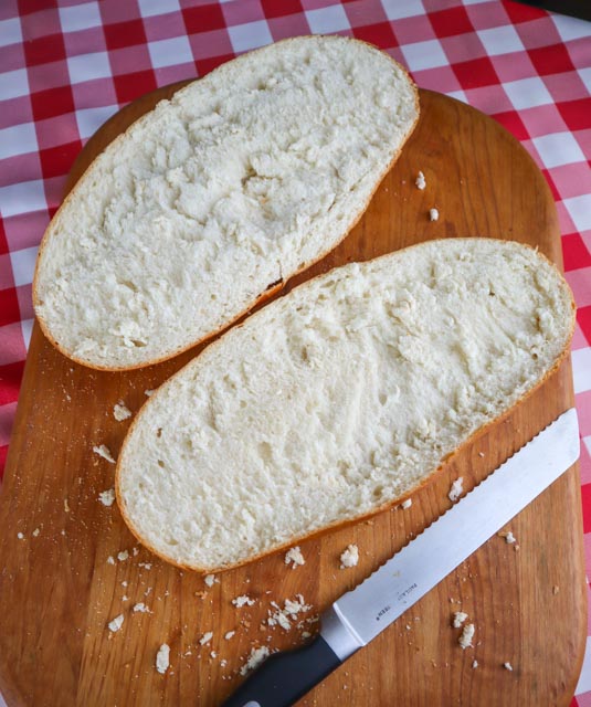 a loaf of italian bread cut into halves lengthwise