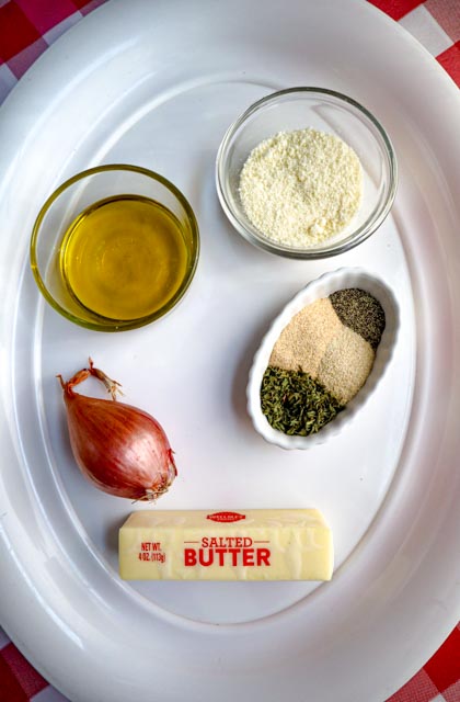 ingredients for homemade garlic bread butter olive oil shallot parmesan cheese herbs and spices