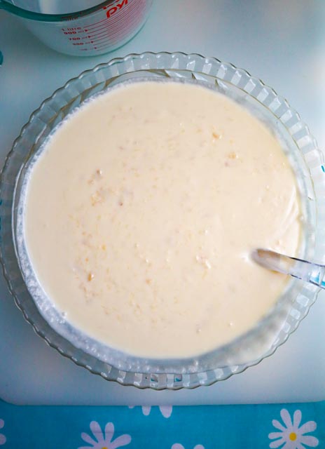 pineapple cream dessert mixed in bowl ready to refrigerate