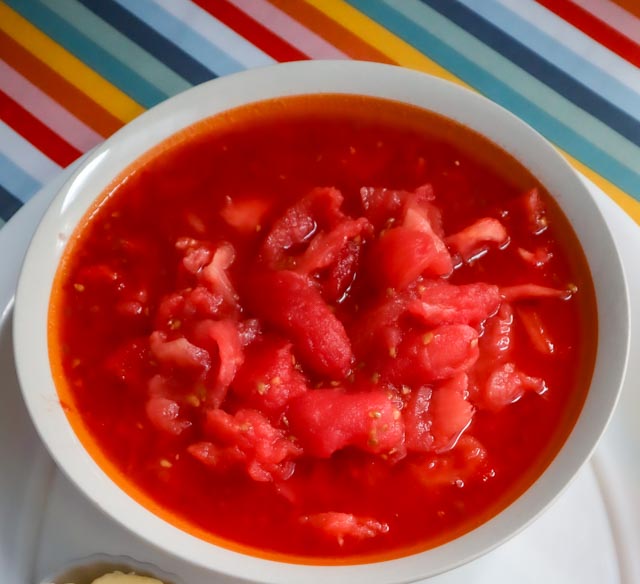 a bowl of hand crushed peeled plum tomatoes 