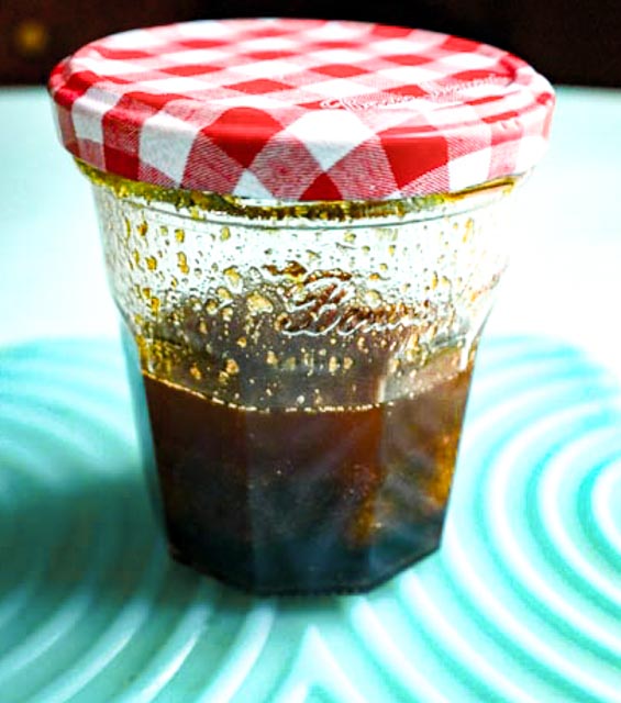 marinade ingredients shaken up in a glass bottle