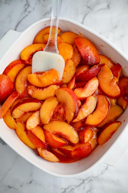 slices of nectarine mixed with sugar and corn starch