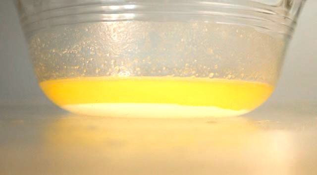 side view of broken butter with water on bottom