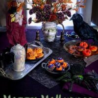 spooky halloween table setting in purple and black