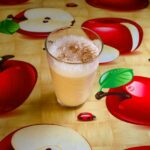 a frothy cider frappe in a large glass