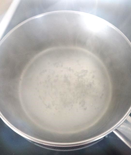 making a simple syrup in a saucepan sugar and water