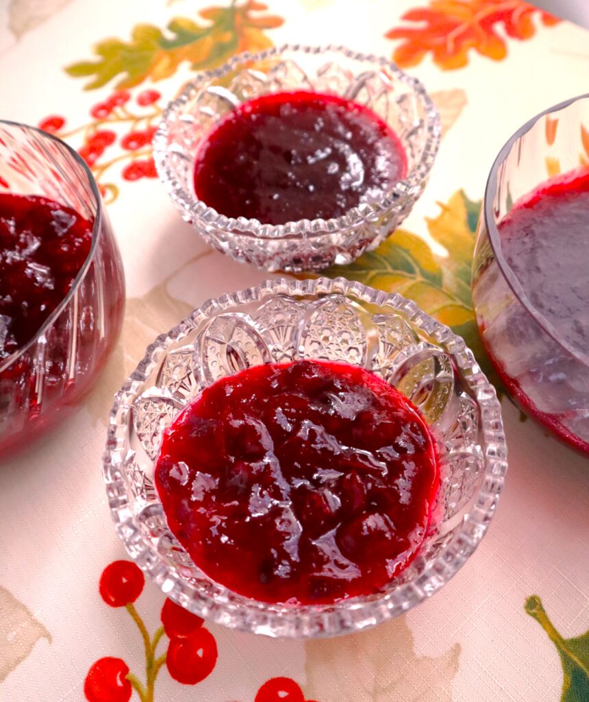 whole berry and strained jellied homemade cranberry sauce in serving bowls and induvial bowls