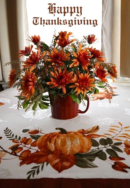 happy thanksgiving flower table arrangement on thanksgiving table cloth